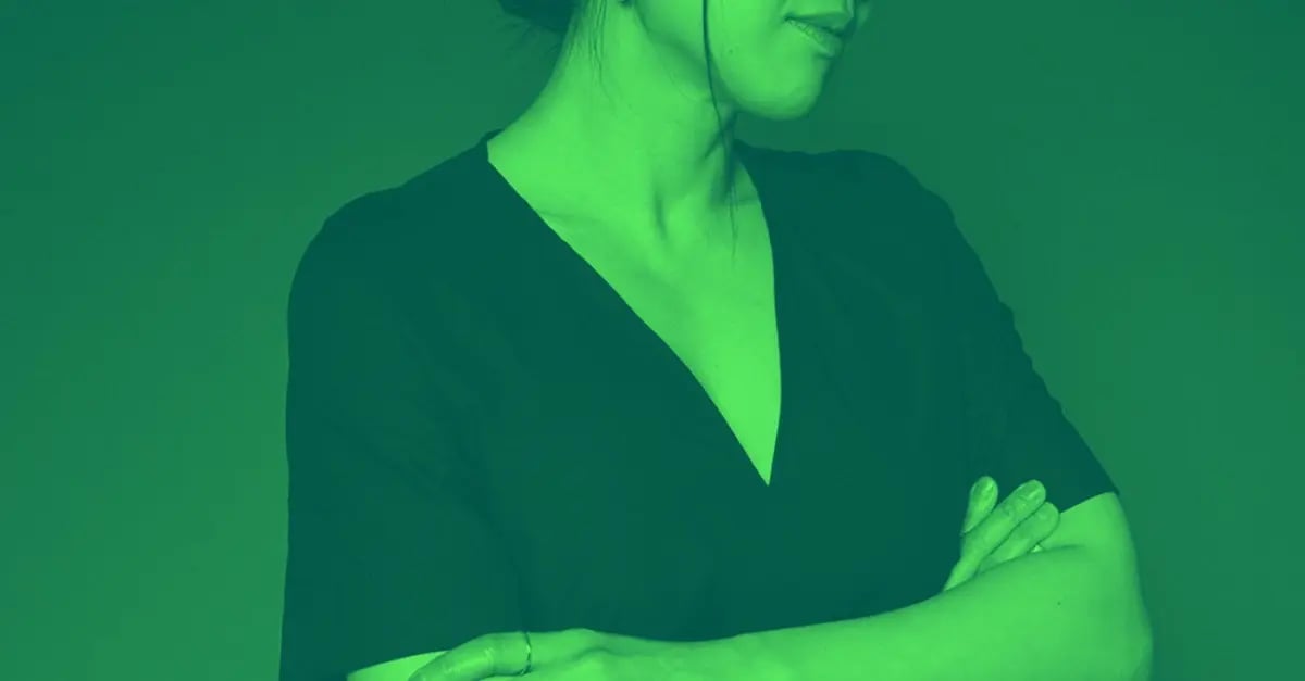 A woman with her arms folded